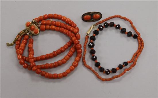 A triple strand coral bead bracelet with French silver mark, a coral and facetted bead necklace and a coral mounted clasp.